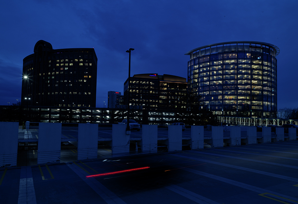 Office towers lit up at dusk